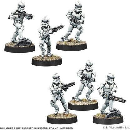 Six painted Star Wars Legion Clone Troopers miniature figures are displayed in dynamic combat poses holding rifles and a heavy blaster on textured circular bases