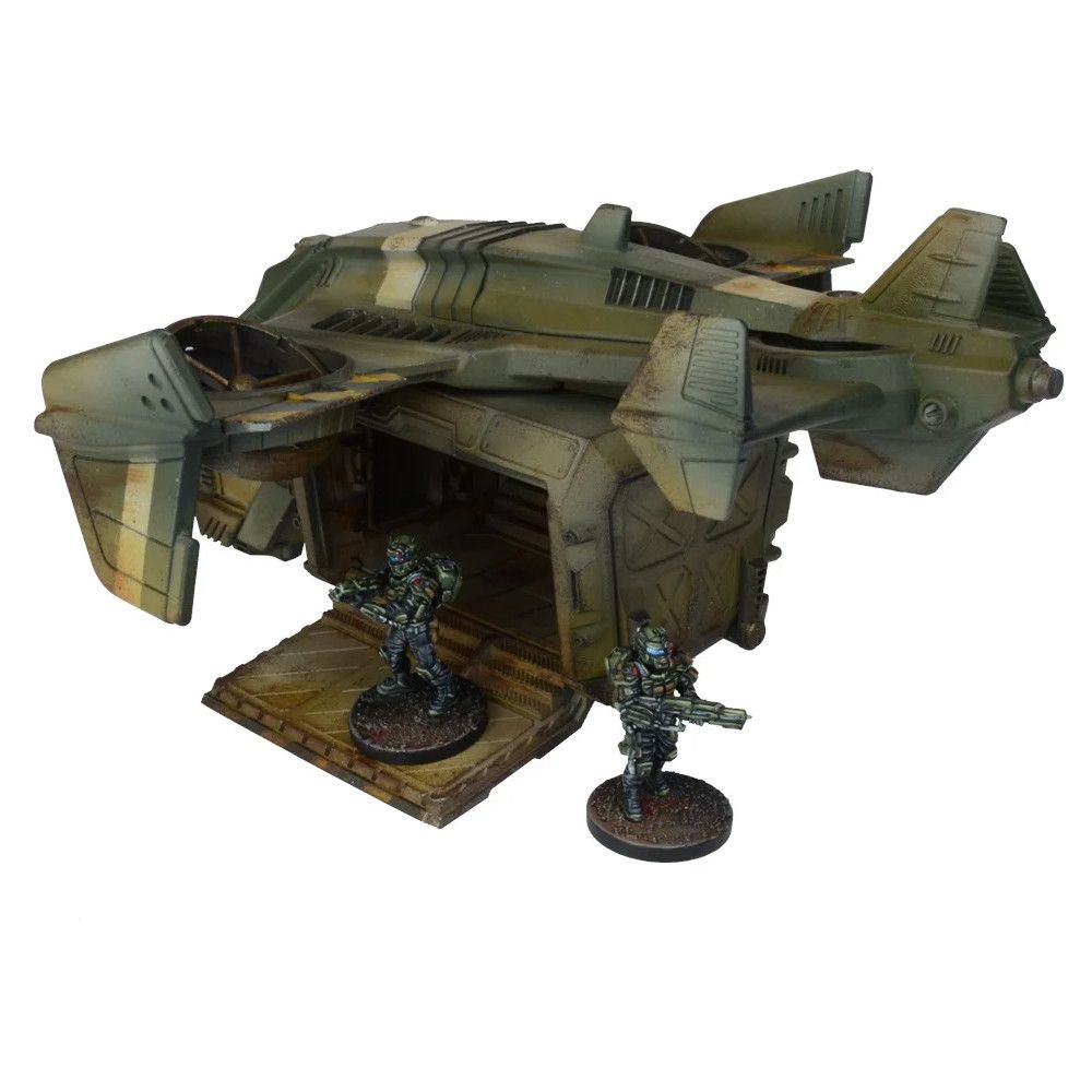 Detailed miniature of a weathered green sci-fi dropship with its ramp open, two armored soldiers disembarking