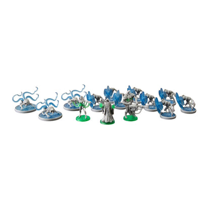 Collection of game miniatures: robed wizard, two green-glowing warriors, blue tentacled beasts, and grey shielded soldiers.