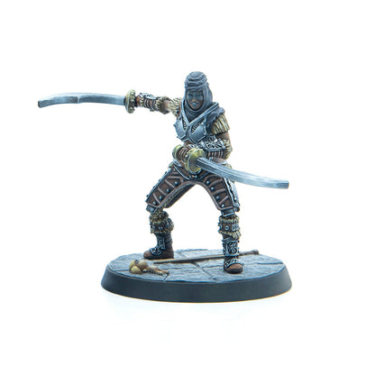 Painted miniature of a dark-skinned female warrior in armor and headwrap, lunging with two curved swords