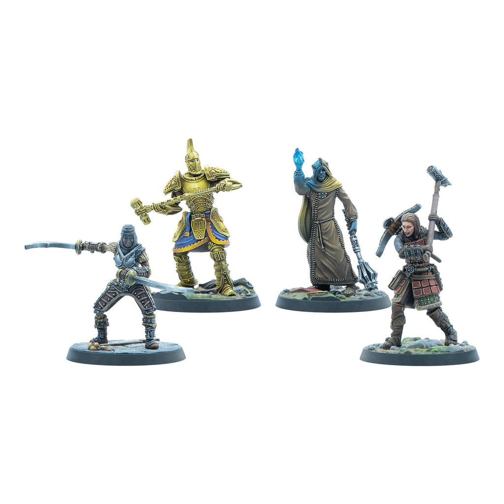 Four painted fantasy miniatures: a swordsman, a golden armored warrior, a cloaked mage with a glowing orb, and an axe-wielding fighter