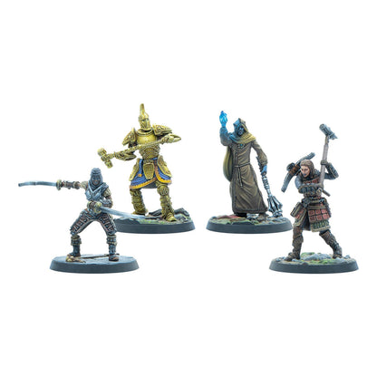 Four painted fantasy miniatures: a swordsman, a golden armored warrior, a cloaked mage with a glowing orb, and an axe-wielding fighter