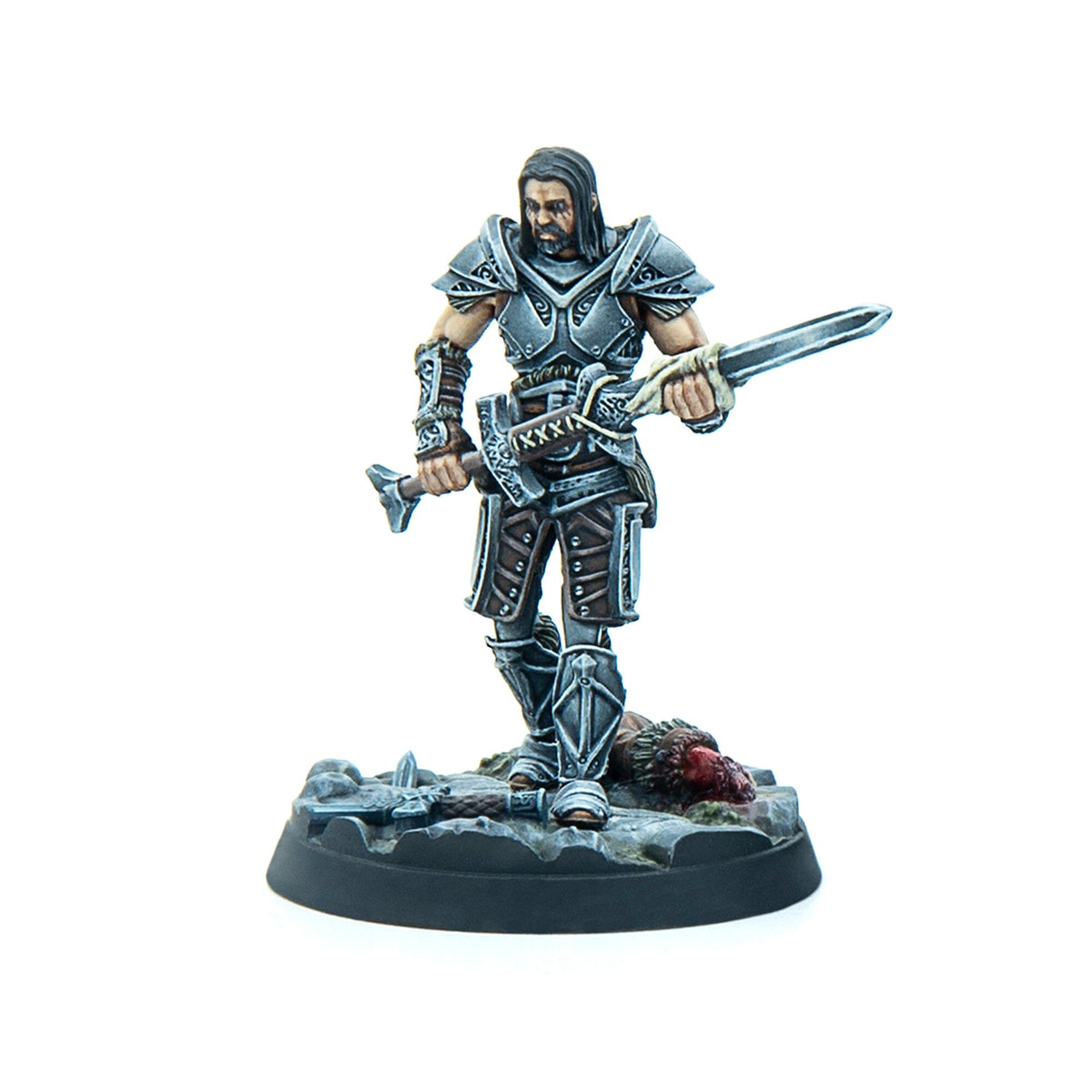 Miniature of a grim warrior in ornate armor holding a sword, standing over a bloodied beast