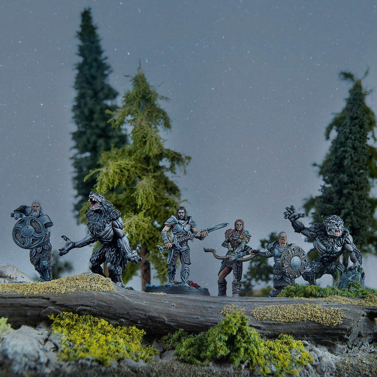 Miniature fantasy figures of warriors and werewolves posed on a log in a starry forest scene