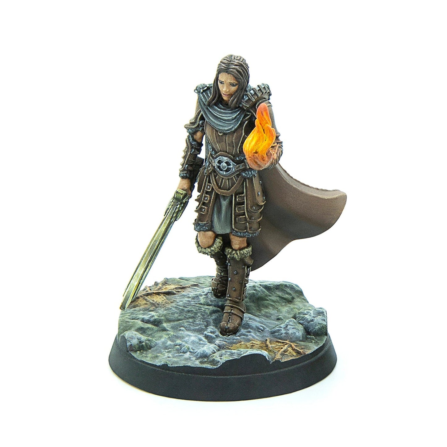 A hand-painted miniature of a female warrior in brown armor, holding a sword and a flame in her hand