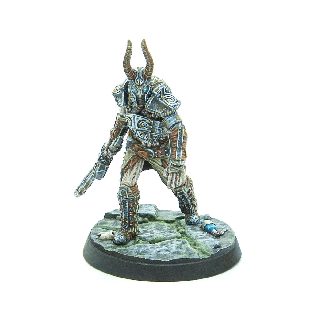 A painted miniature of a horned warrior in ornate armor with glowing blue eyes, holding a sci-fi blaster, standing