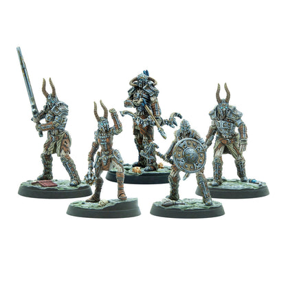 Five horned fantasy warrior miniatures in armor, holding various weapons like swords, bows, and shields, on display