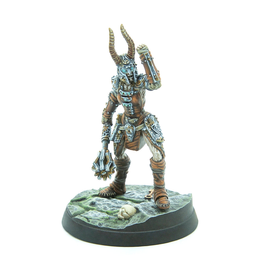 A horned, armored fantasy miniature holds a mace, one arm raised, standing on a skull-adorned base