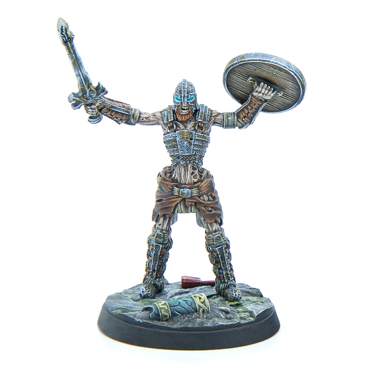 A miniature skeletal warrior in armor with glowing blue eyes, raising a sword and a round shield