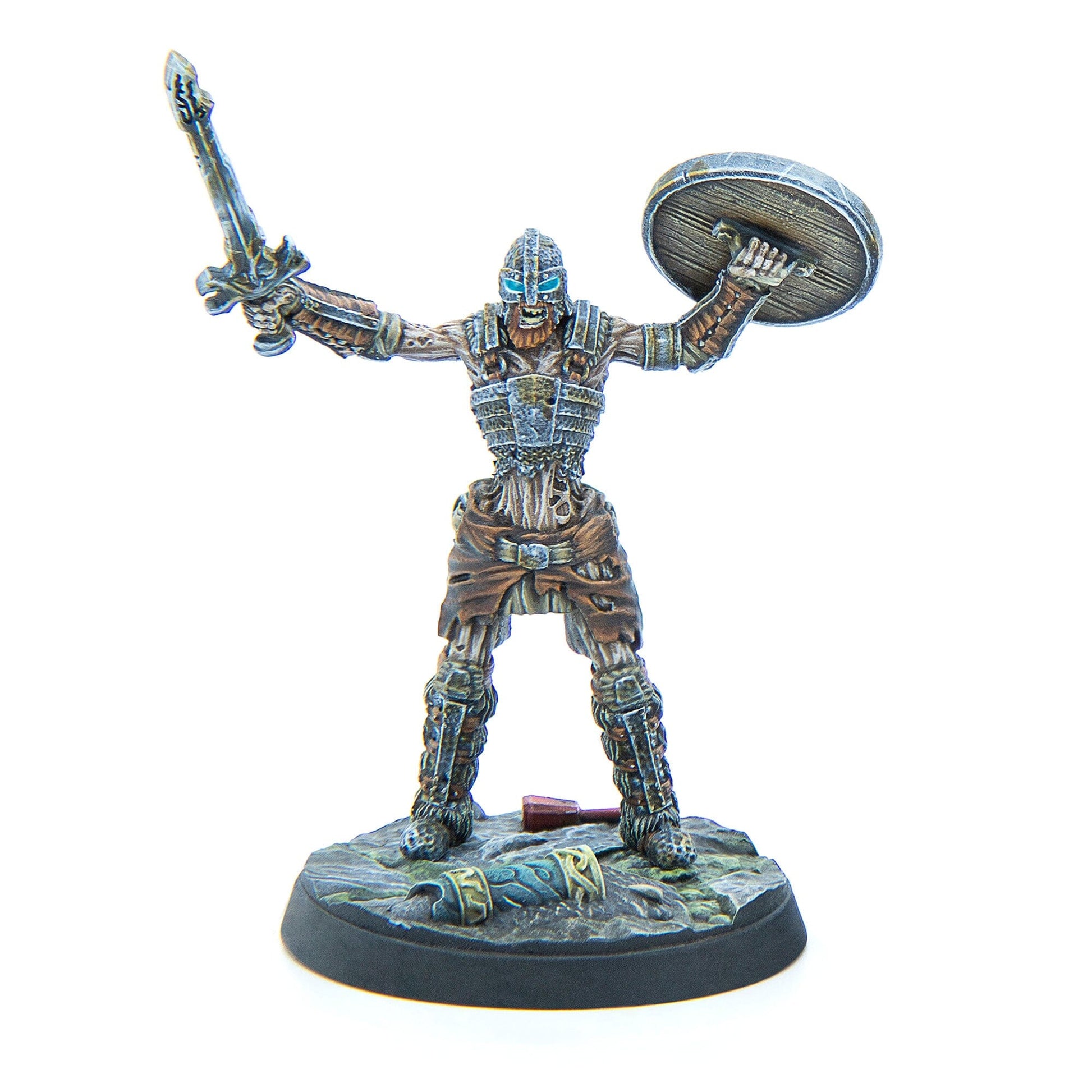 A miniature skeletal warrior in armor with glowing blue eyes, raising a sword and a round shield