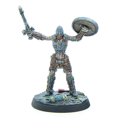A miniature skeletal warrior in armor with glowing blue eyes, raising a sword and a round shield