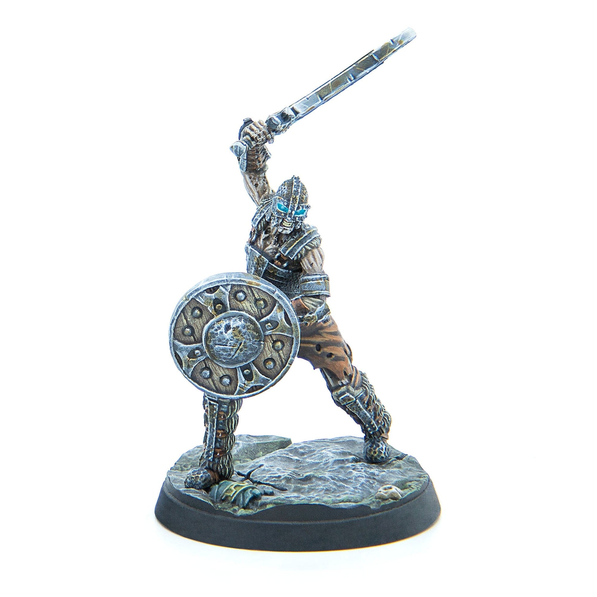 Armored miniature warrior raises sword overhead, holds a shield, and has glowing blue eyes