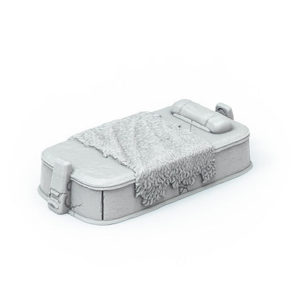 A grey unpainted miniature bed with a textured fur blanket and bolster pillow