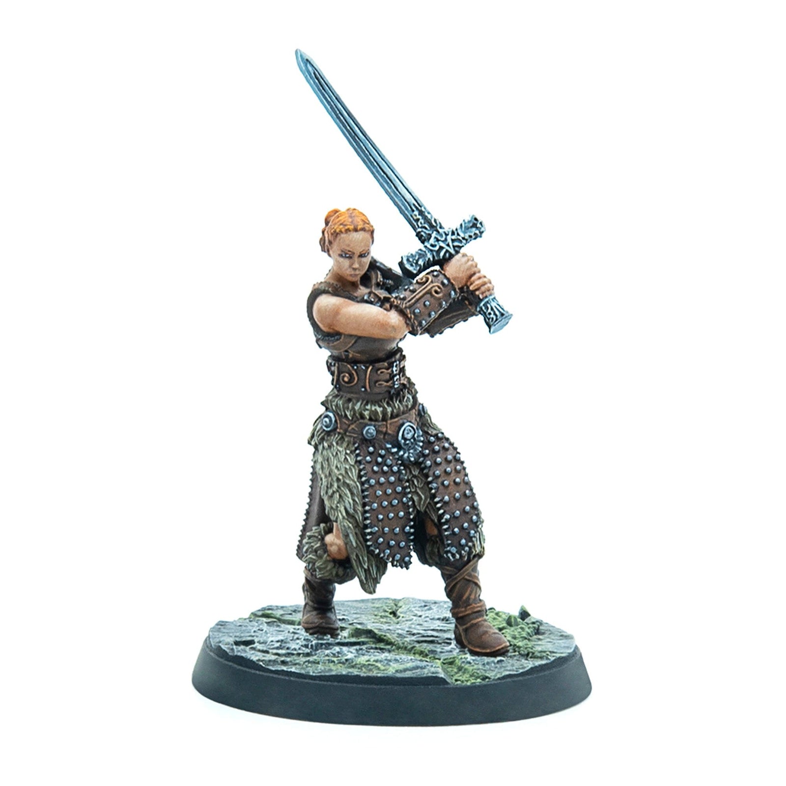 Miniature of a red-haired female warrior in studded leather and fur, raising a large two-handed sword.