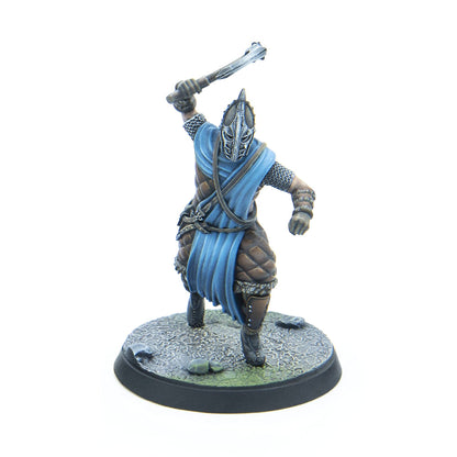 Miniature warrior in an ornate helmet and blue tunic, raising a spiked mace for an attack