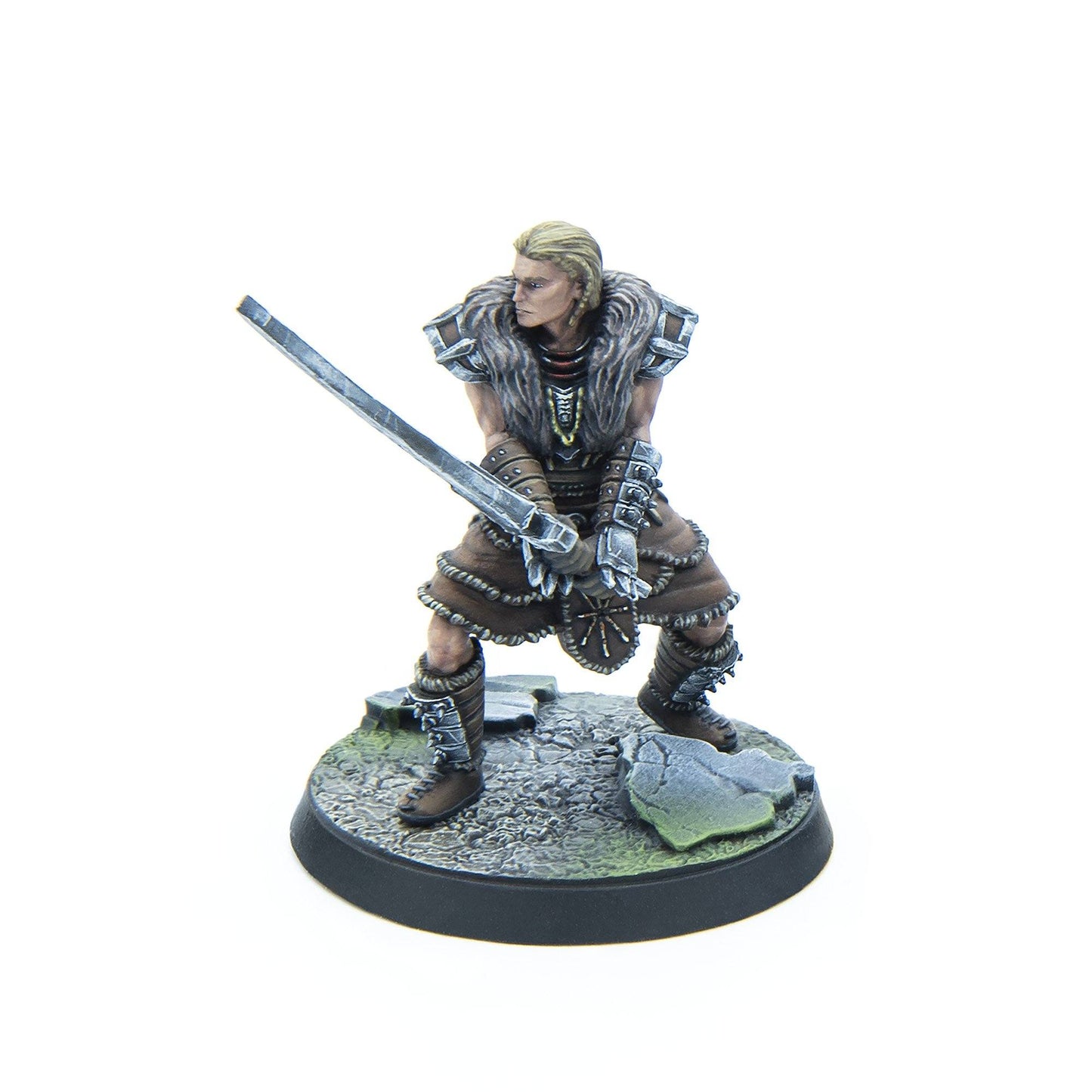 Miniature of a blonde barbarian in fur armor, wielding a two-handed sword, ready for combat