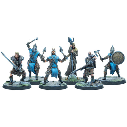 Six fantasy warrior miniatures in action poses, armed with swords, axes, a shield, and a staff