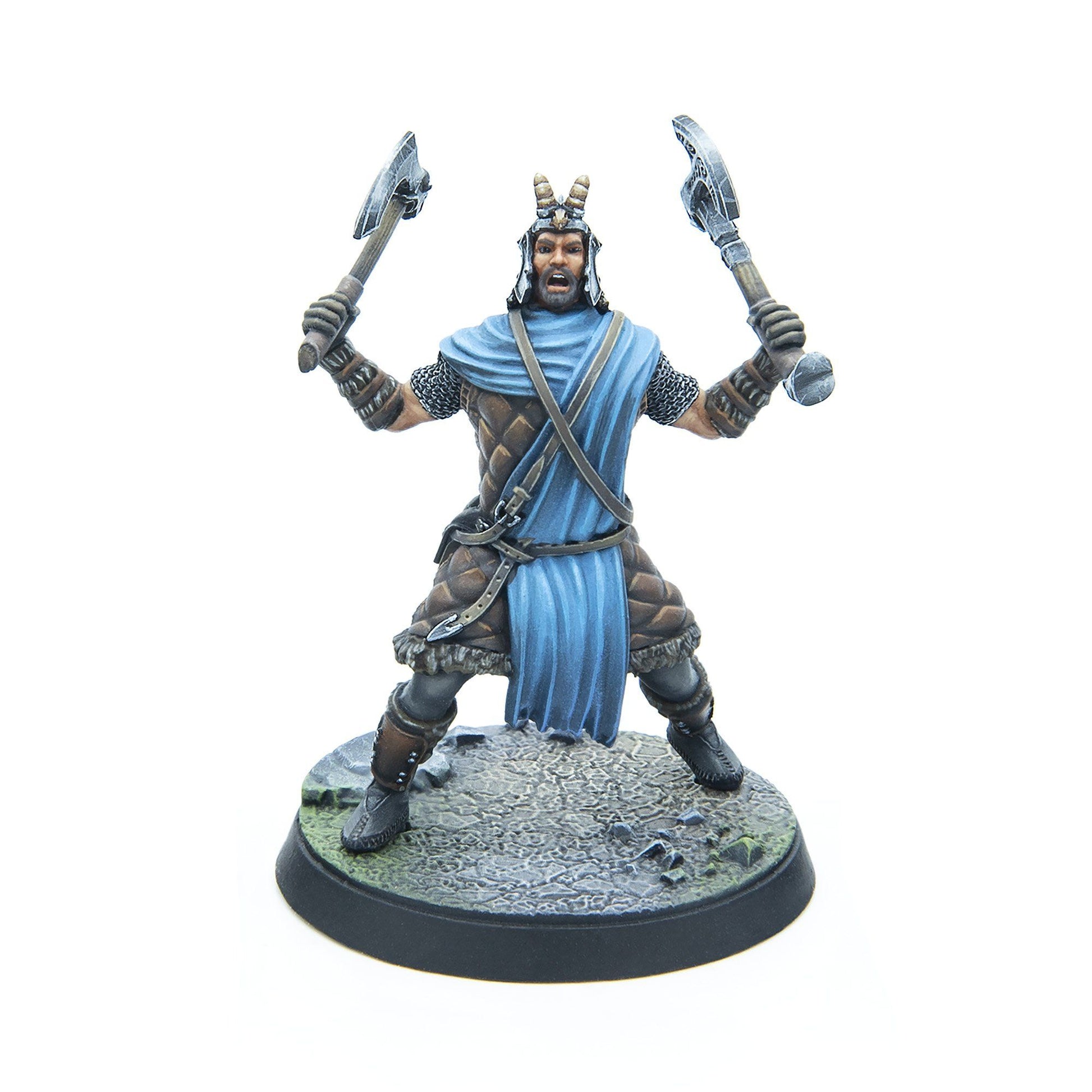 A painted miniature of a fierce warrior in a horned helmet and blue cloak, dual-wielding raised axes