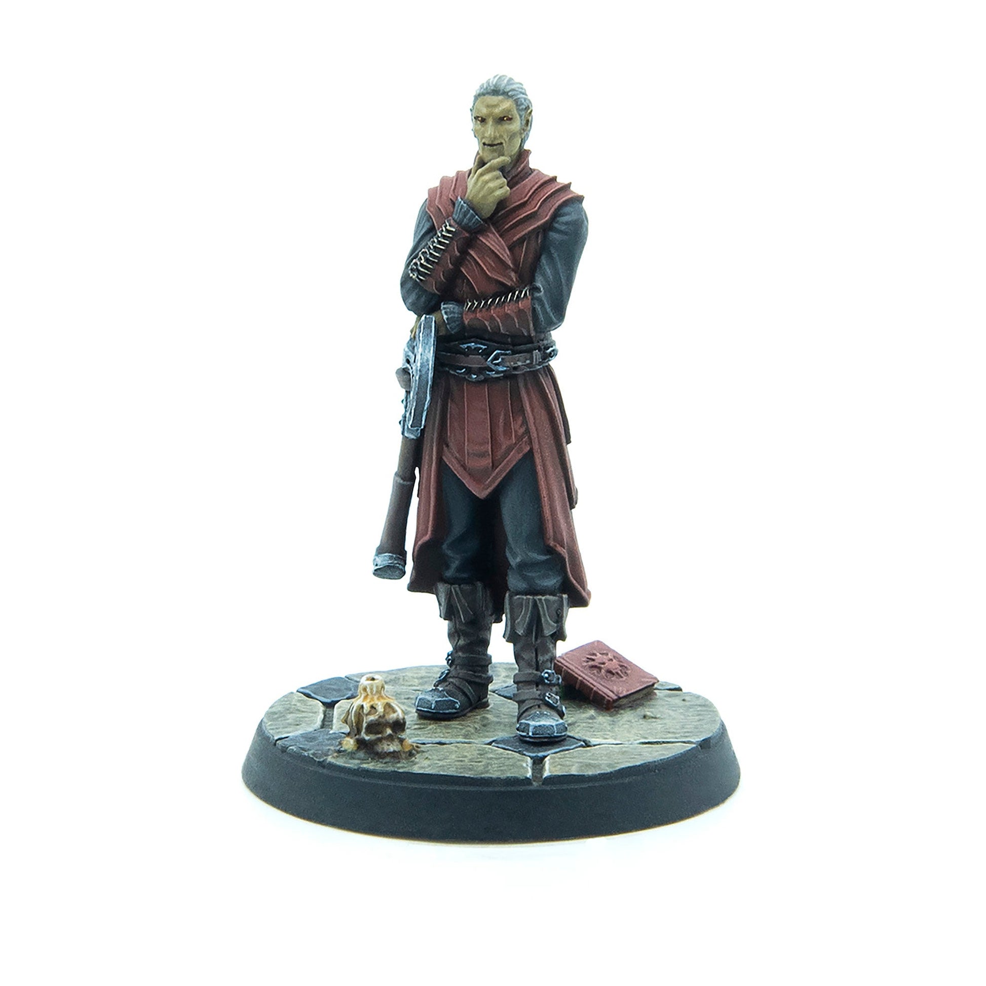 A fantasy miniature depicts a pale man in red robes, standing thoughtfully with hand on chin