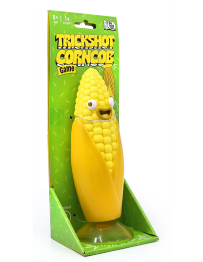 Novelty toy packaging for the "Trickshot Corncob Game," featuring a cheerful, plastic corn on the cob