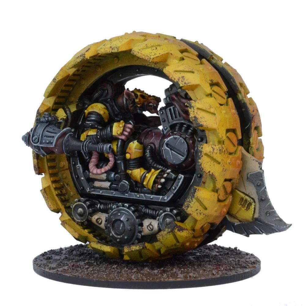 A miniature of a rat-like creature piloting a large, yellow mono-wheel vehicle with a side-mounted cannon