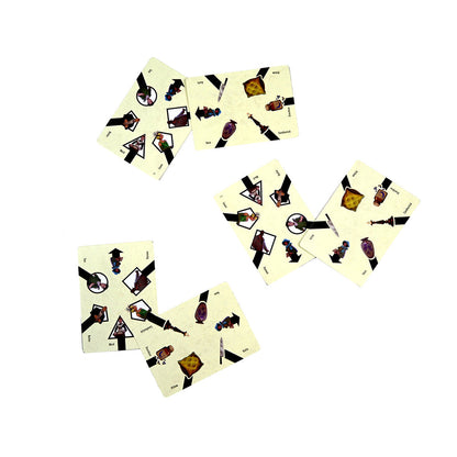 Scattered game cards with illustrations of characters (Maid, Butler) and objects (Knife, Vase) on a white surface