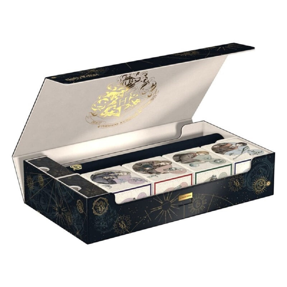Open Harry Potter collector's box with a gold Hogwarts crest, containing a wand and four small illustrated boxes