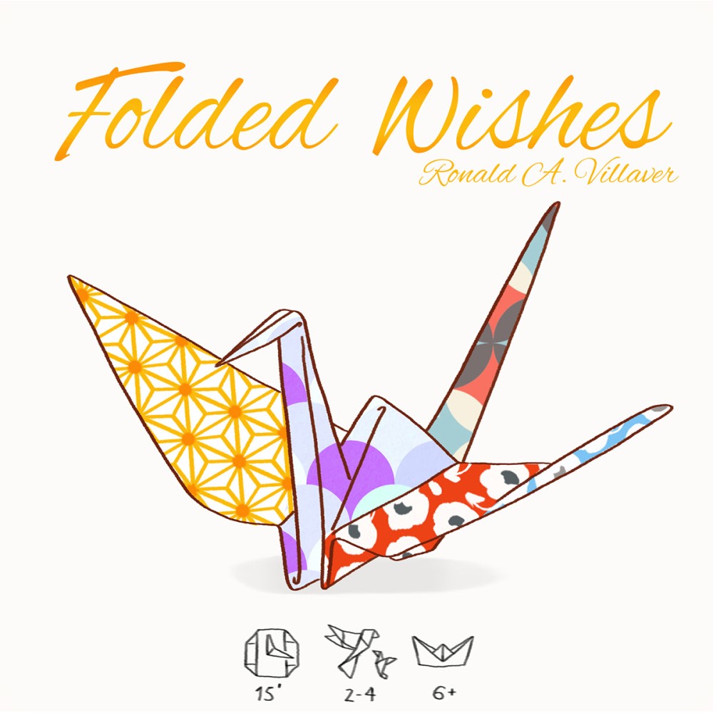A colorful origami crane made from patterned paper. Title: 'Folded Wishes' by Ronald A. Villaver.