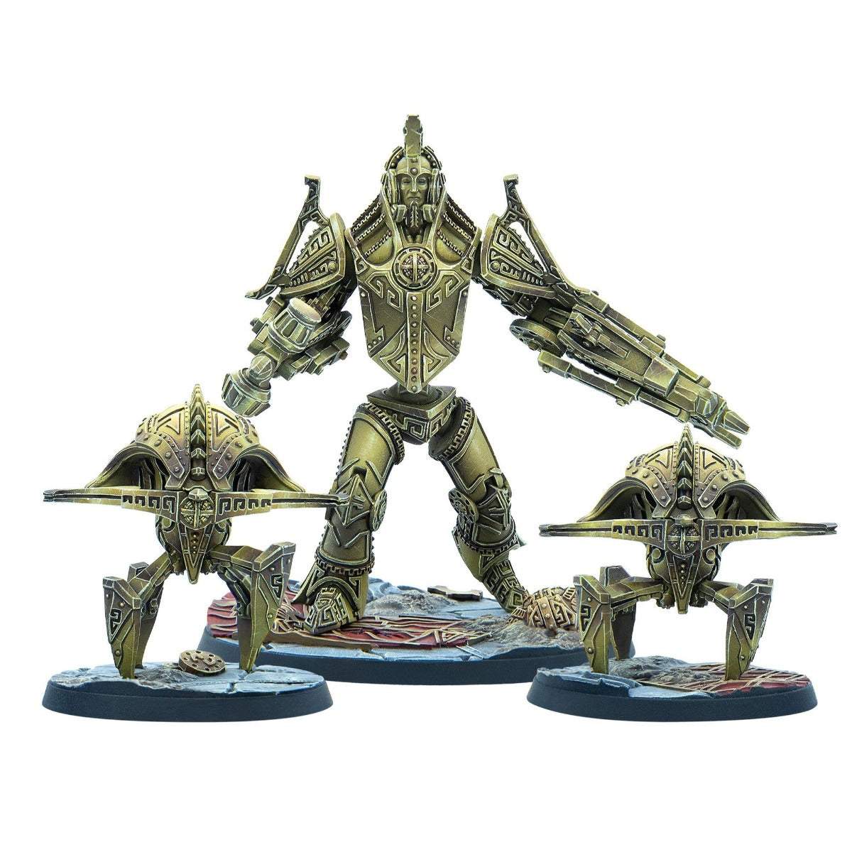 Ornate bronze-gold humanoid mech miniature with weapon-arm stands between two smaller four-legged drones.
