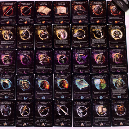 Dozens of dark fantasy game cards with vibrant illustrations and text arranged in rows.