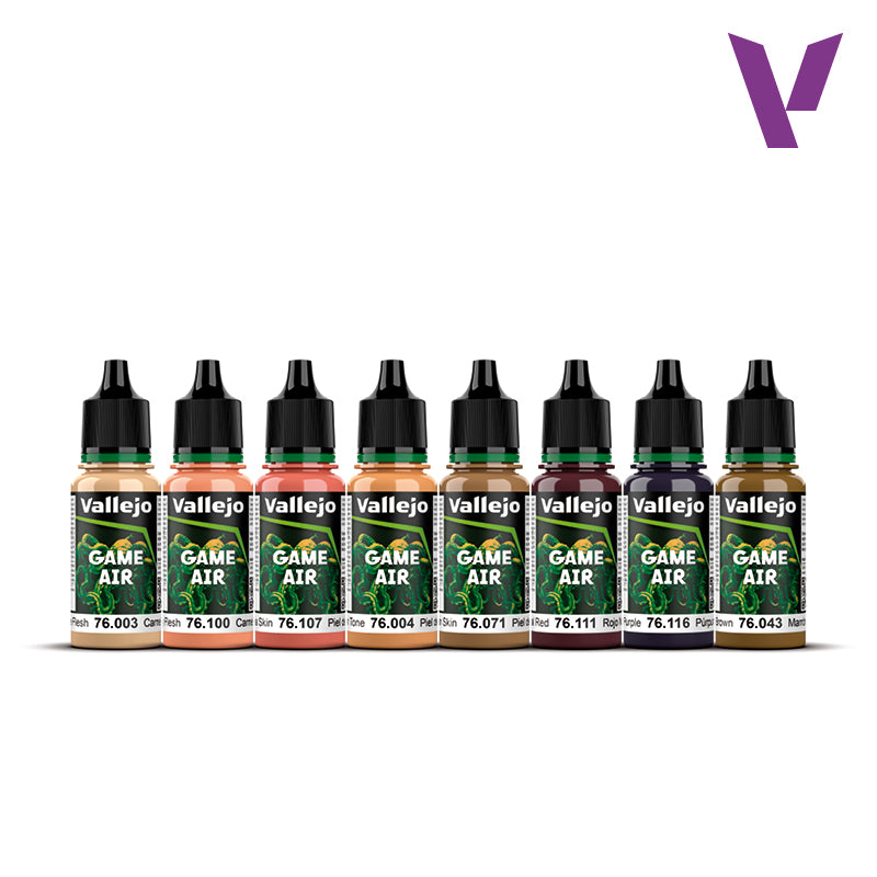 Eight Vallejo Game Air dropper bottles of paint in various flesh, peach, red, purple, and brown shades