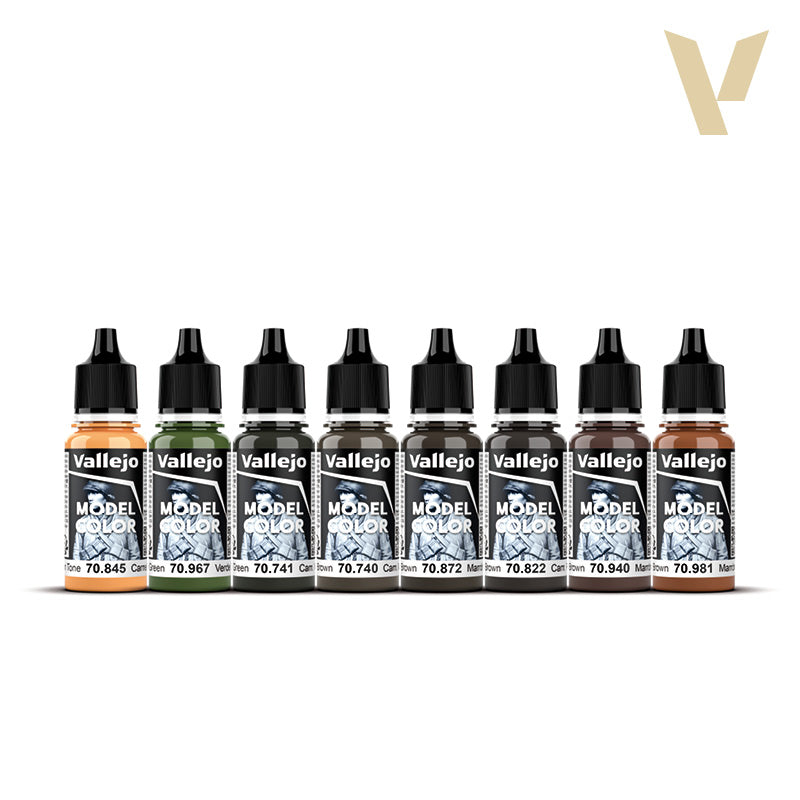 Eight Vallejo Model Color paint bottles in a line, featuring greens, browns, and a skin tone with black dropper caps