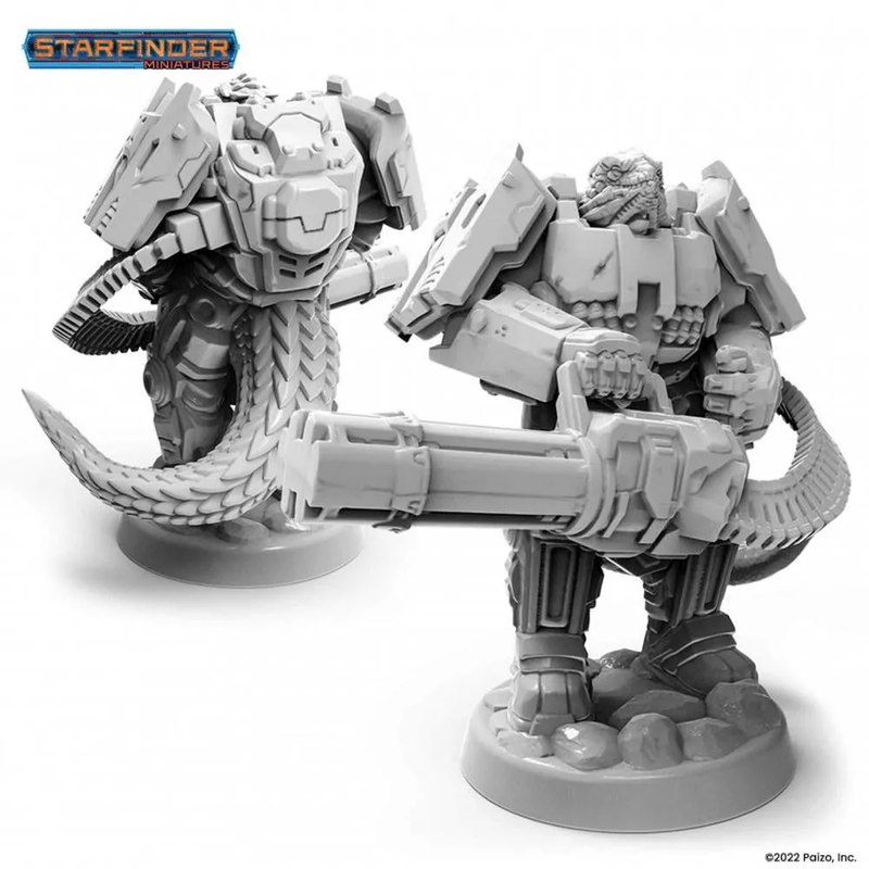 Two grey unpainted Starfinder Vesk Mercenary miniatures: a reptilian in power armor wielding a minigun, and another from the back