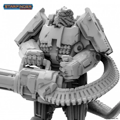 Starfinder miniature: Grey reptilian warrior in power armor, wielding a large gatling gun with ammo belt