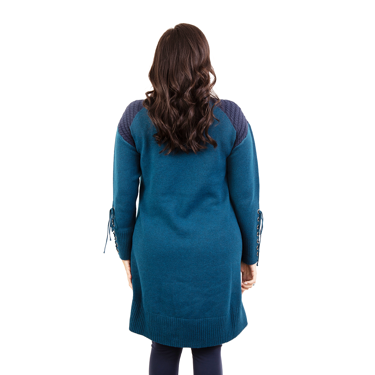 Woman from behind in a long teal tunic with textured navy shoulders and lace-up cuffs