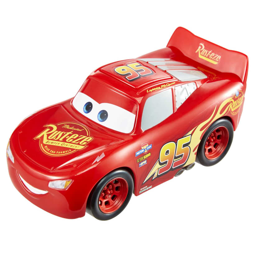 A red Lightning McQueen toy car with a smiling face, blue eyes, "95" on its side, and "Rust-eze" logo