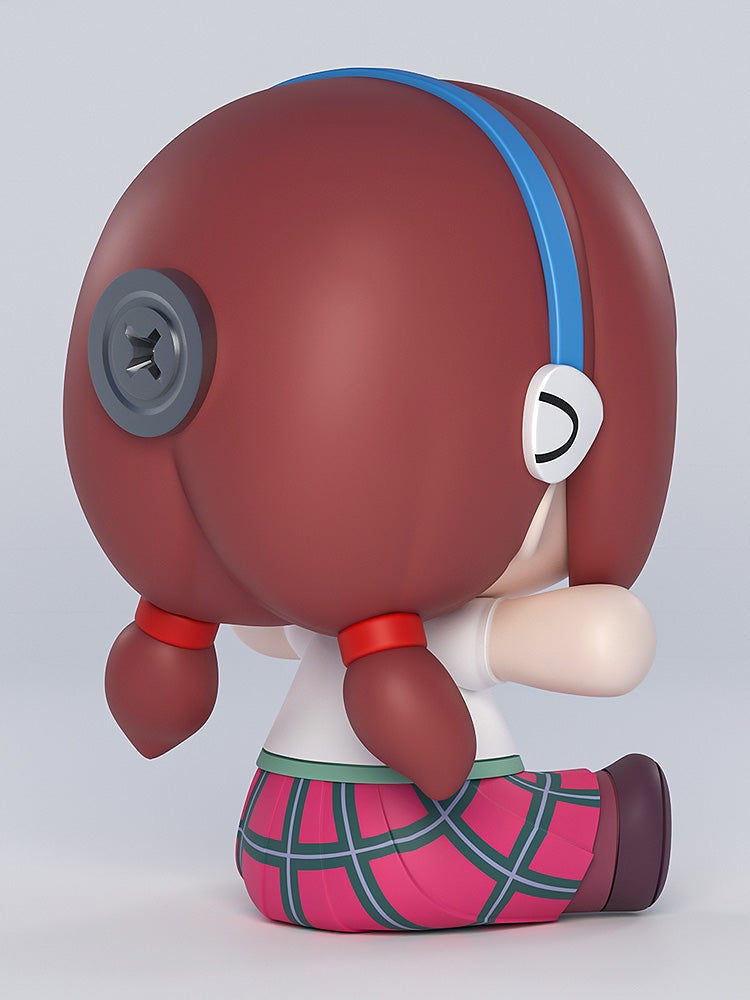 Side view of sitting anime figure in school uniform with red glasses, brown hair, and flower-shaped eyes