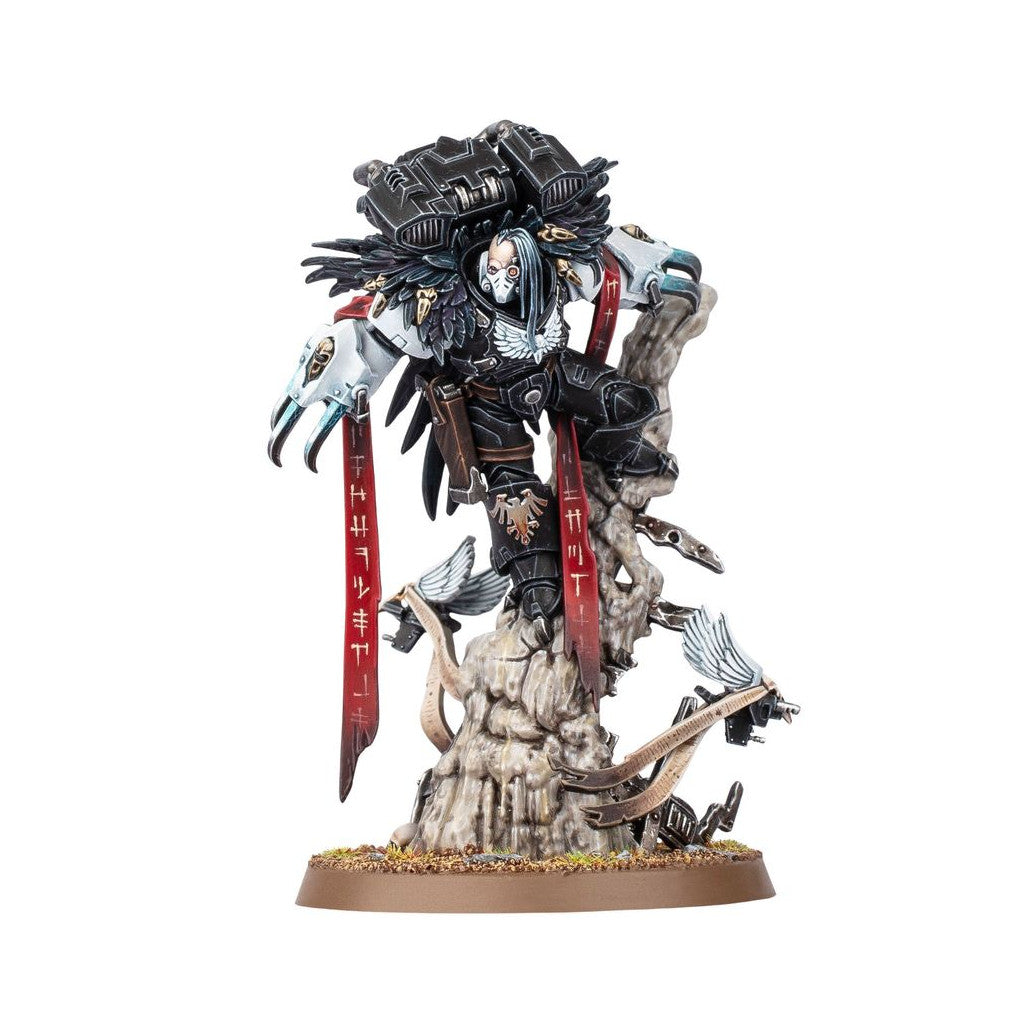 Black armored warrior miniature with winged pauldrons and white mask, standing dynamically on a rocky outcrop