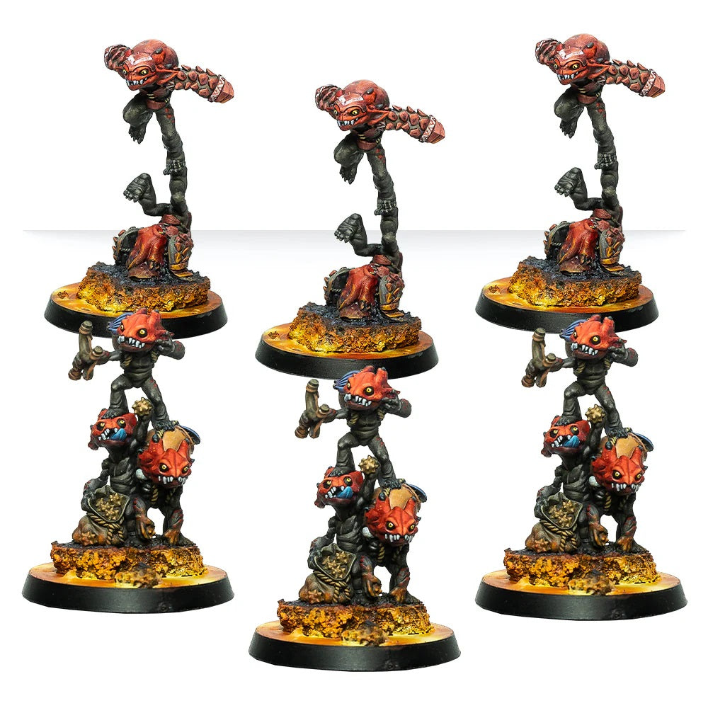 Six painted demonic miniature figures: three floating red Horrors and three stacks of smaller daemons on fiery bases