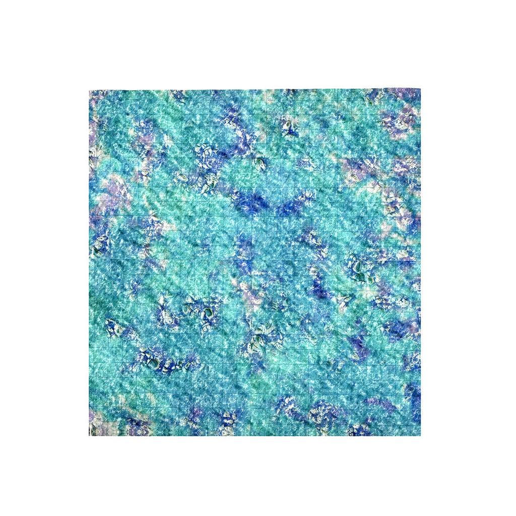 Abstract mottled pattern of blue, teal, and white, with a subtle grid texture