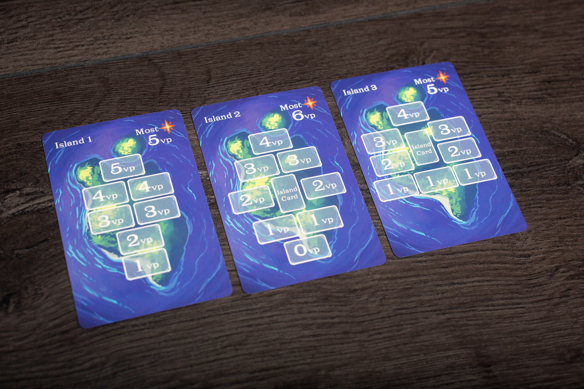 A wide angle photo showing a full Isle of Night game session on a wooden table with players’ hands, cards, and game components