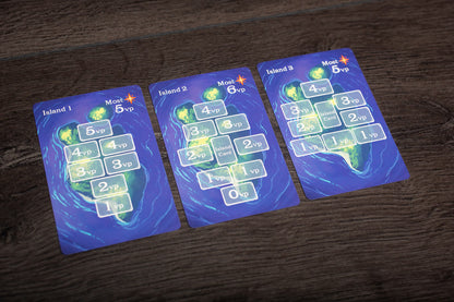 A wide angle photo showing a full Isle of Night game session on a wooden table with players’ hands, cards, and game components