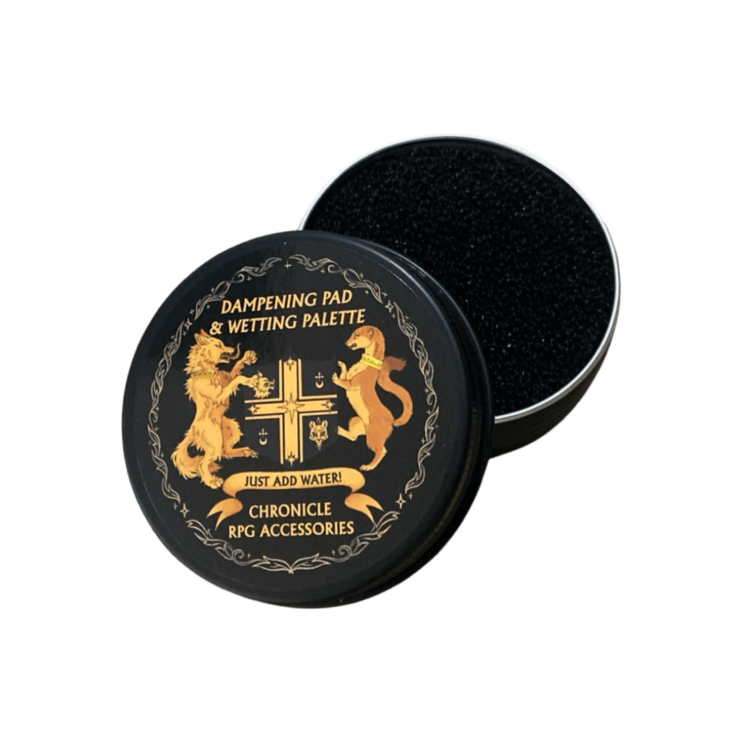 An open tin of green tea vegan brush soap with a tiger logo. A white Kambuku brush rests with its black bristles touching the bright green soap