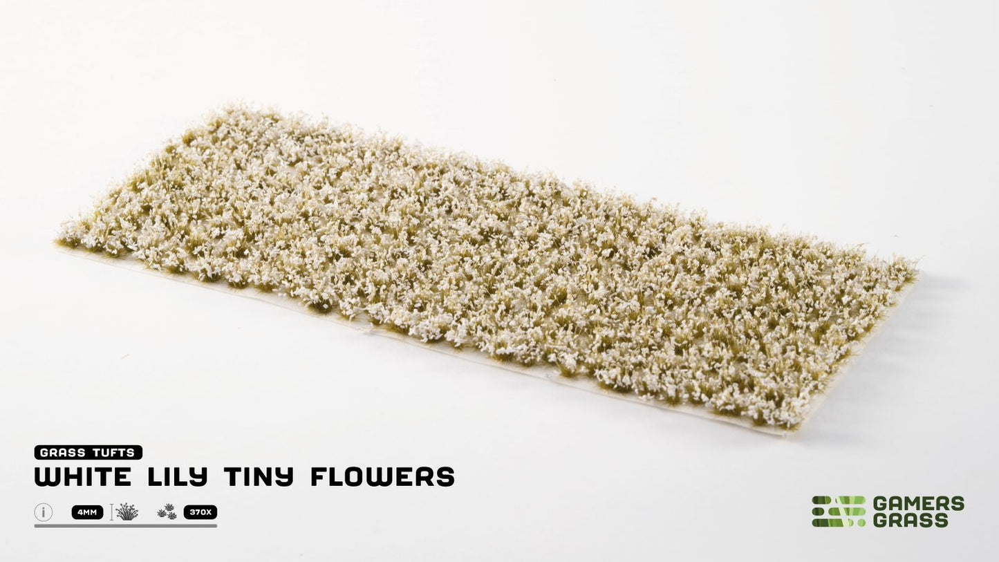 Miniature grass tufts, 4mm, covered in dense tiny white flowers on an adhesive backing strip for model scenery