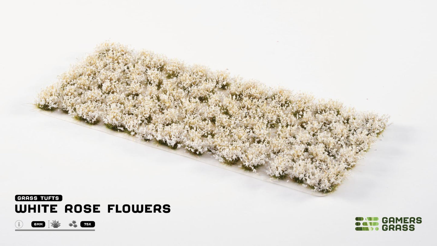 Miniature white rose flower tufts on a sheet for diorama scenery