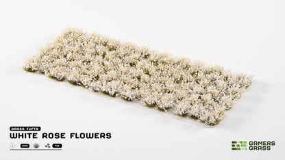 Miniature white rose flower tufts on a sheet for diorama scenery
