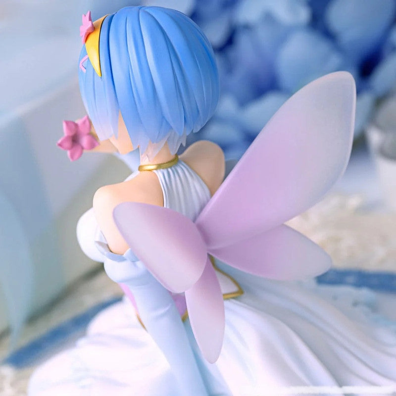 Blue-haired anime fairy figure in a white dress with purple wings