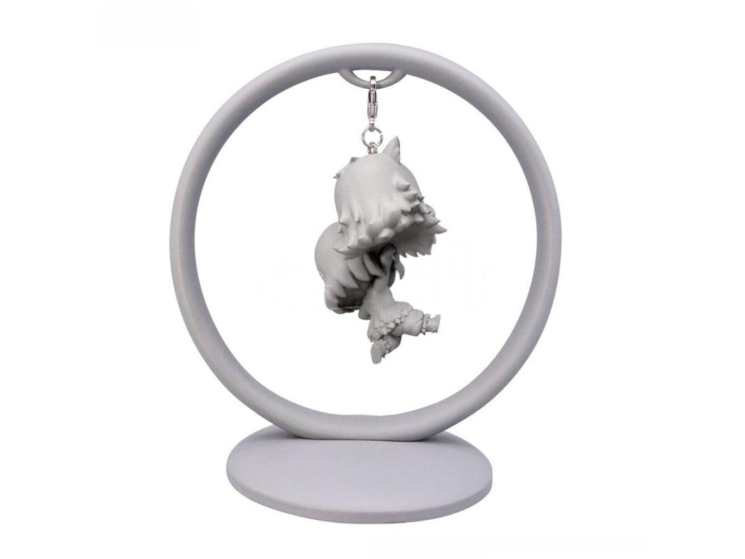 Grey anime keychain of character with spiky hair and large hands on a ring display stand