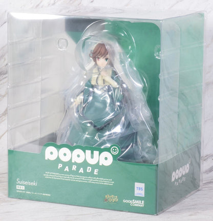 Suiseiseki figure in a green dress posed inside a clear plastic box with POP UP PARADE branding
