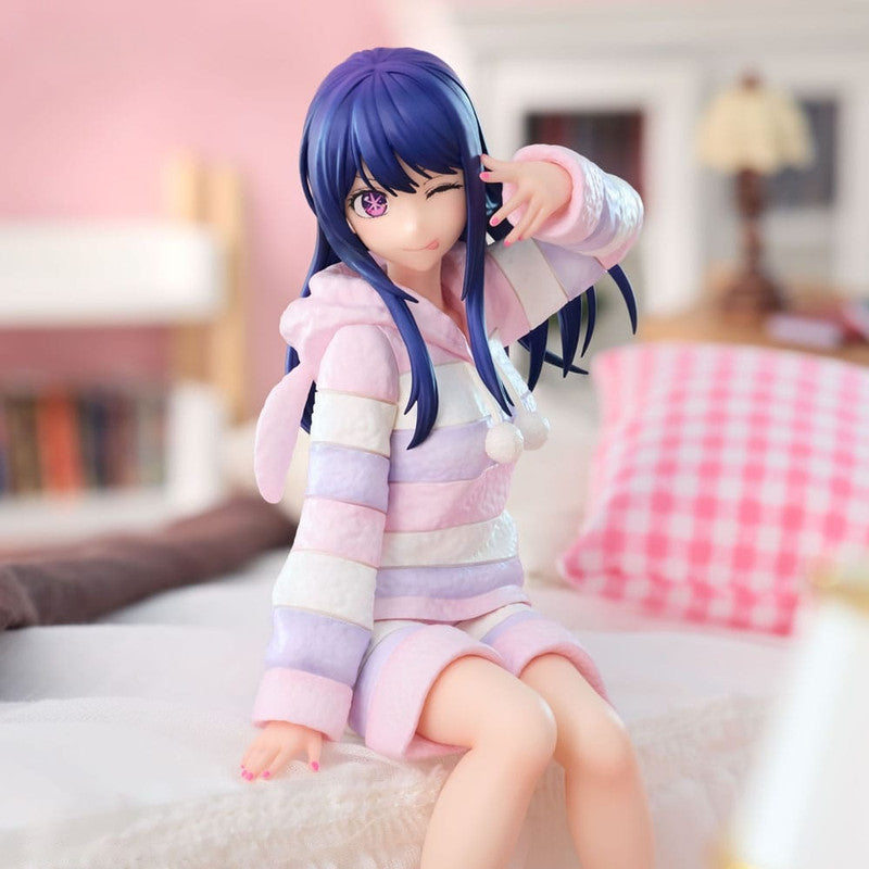 Anime figure of a girl with purple hair in a pastel pink white and purple striped pajama hoodie and shorts